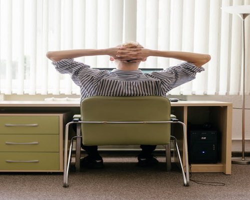 Person taking a break at their computer desk