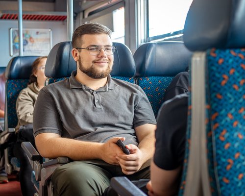 Passenger on public transport with a relaxed posture
